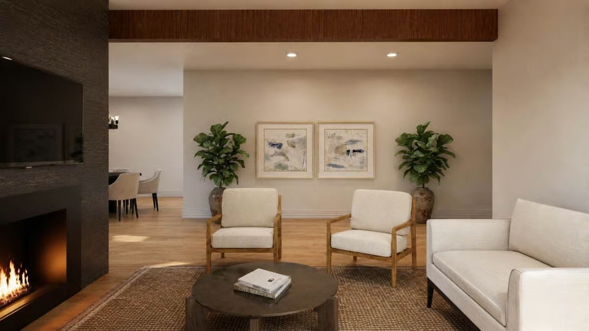 Cream Chairs With Wood Arms, Two Plants, and a Fireplace Already Earning Its Keep