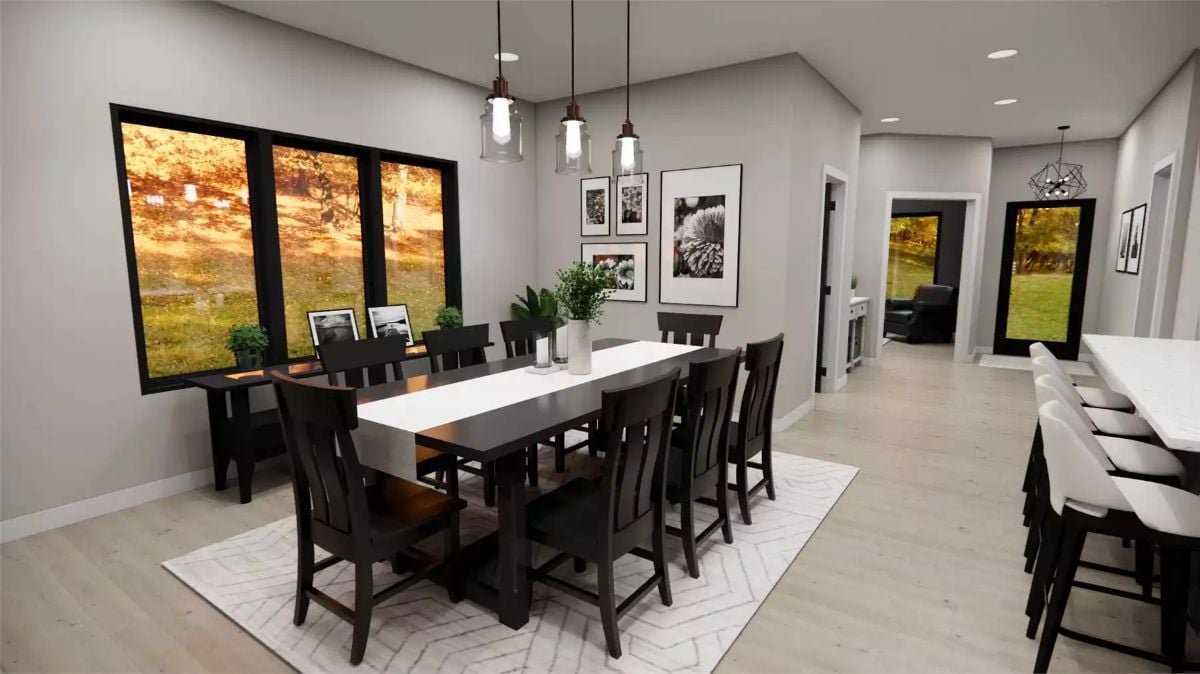 Dark Chairs, Three Pendant Lights, and a Table That Seats Ten Without Apology