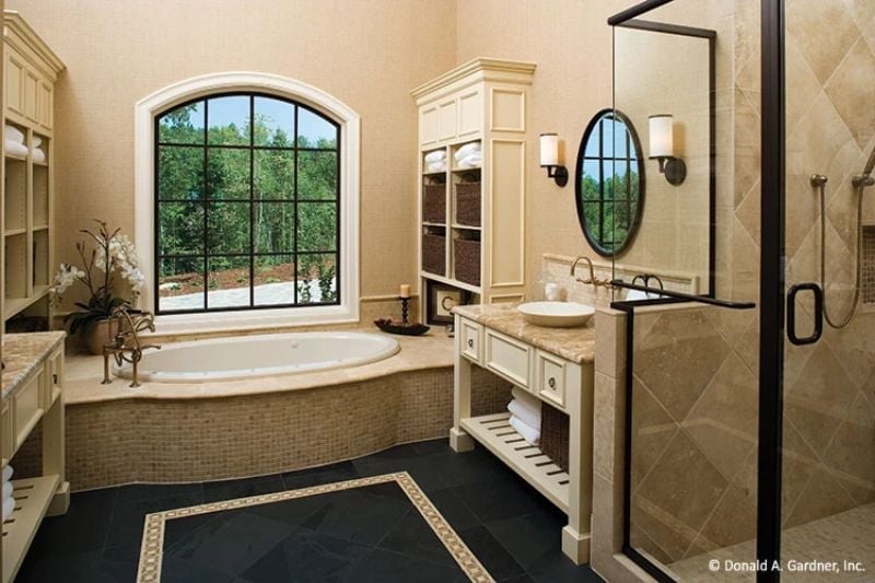 Oval Tub, Mosaic Surround, and a Window That Does All the Work