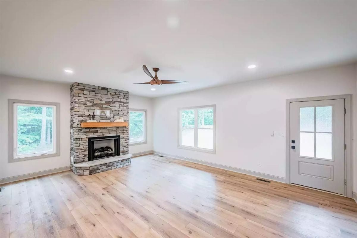 Stone Fireplace with a Raw Wood Mantel That Earns Its Place in the Room