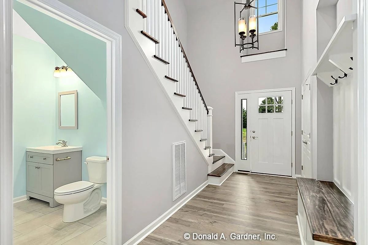 Powder Room Tucked Under the Stairs, Mudroom Built Into the Wall