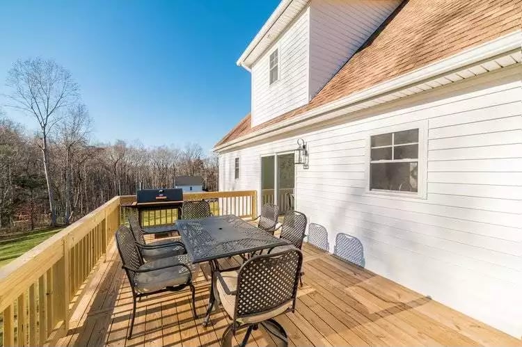 Cedar Deck, Iron Patio Set, and a Grill Positioned Close Enough to Actually Use