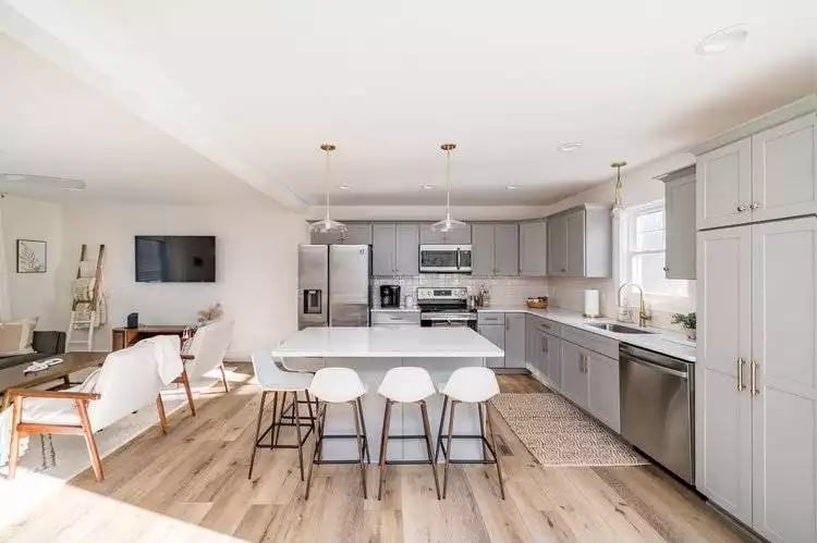 Gray Cabinets, White Island, and Pendant Lights That Don't Overdo It