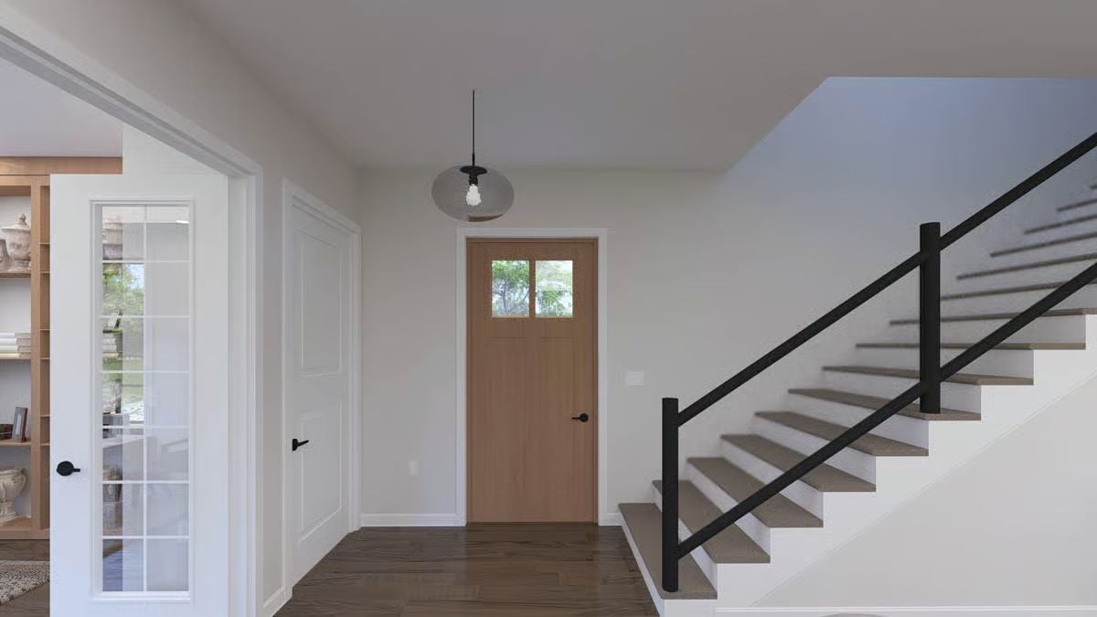 Craftsman Front Door, Black Steel Rail, and a Pendant That Earns Its Spot