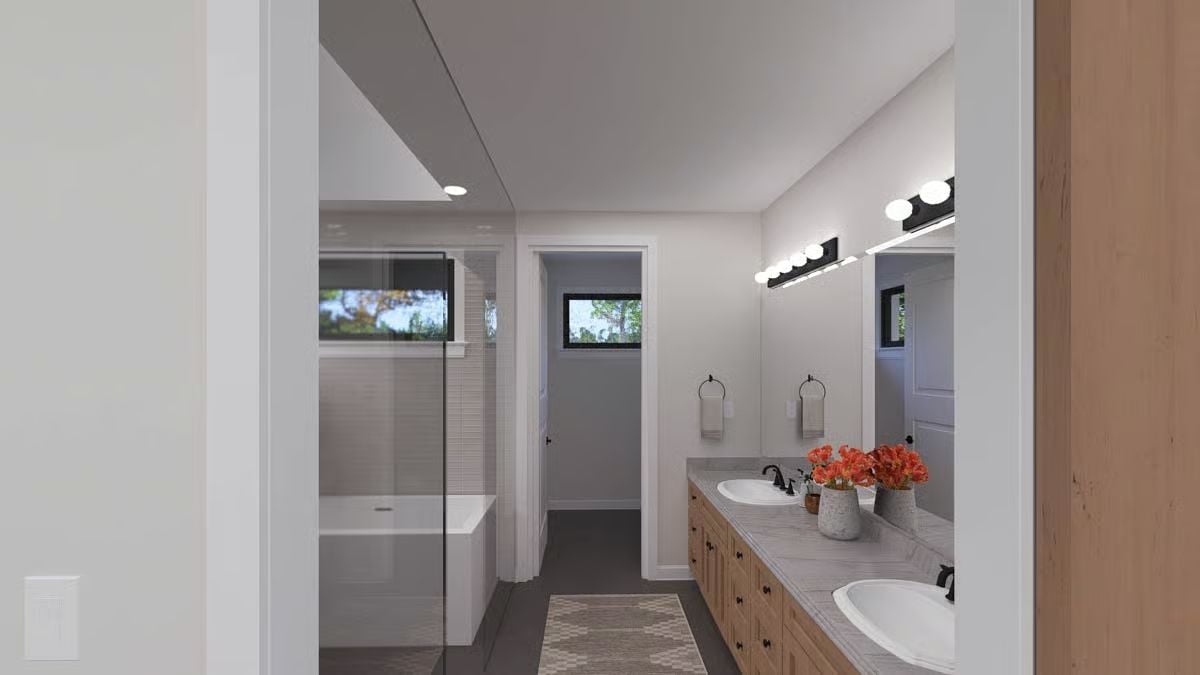 Double Vanity, Warm Wood Cabinets, and a Walk-In Shower That Doesn't Fight for Attention
