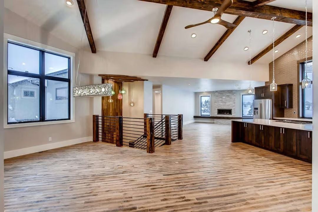Exposed Beams and Colored Glass Pendants Pull the Eye Up and In