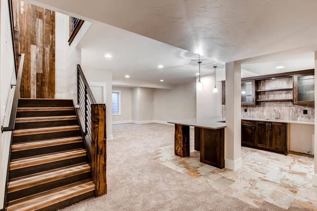 Reclaimed Wood and Raw Steel Turn a Basement Staircase Into the Real Entrance