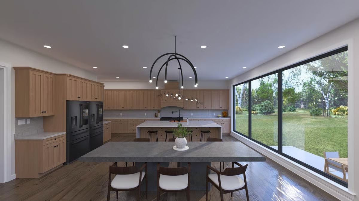 Warm Cabinetry, a Concrete Dining Table, and Glass That Pulls the Yard Inside