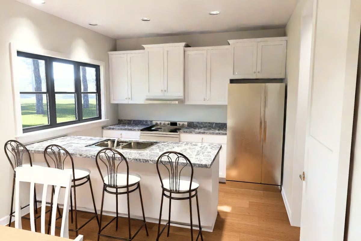 Wraparound Counter Space That Seats Four Without Crowding the Cook