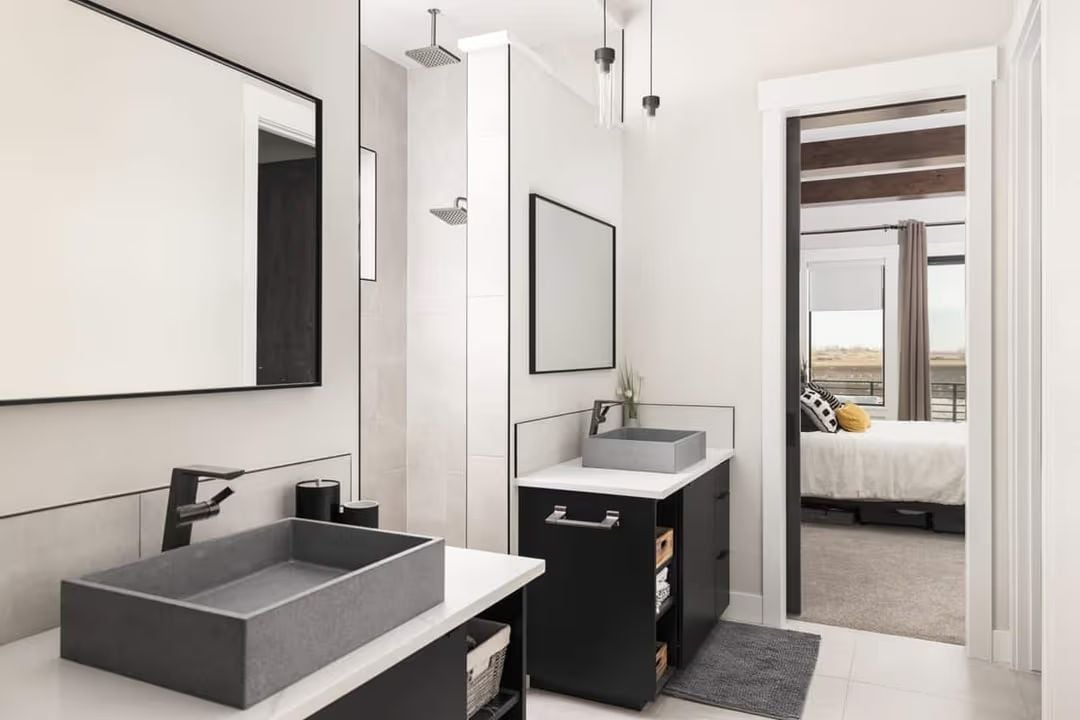 Concrete Vessel Sinks and Black Fixtures Do the Heavy Lifting Here