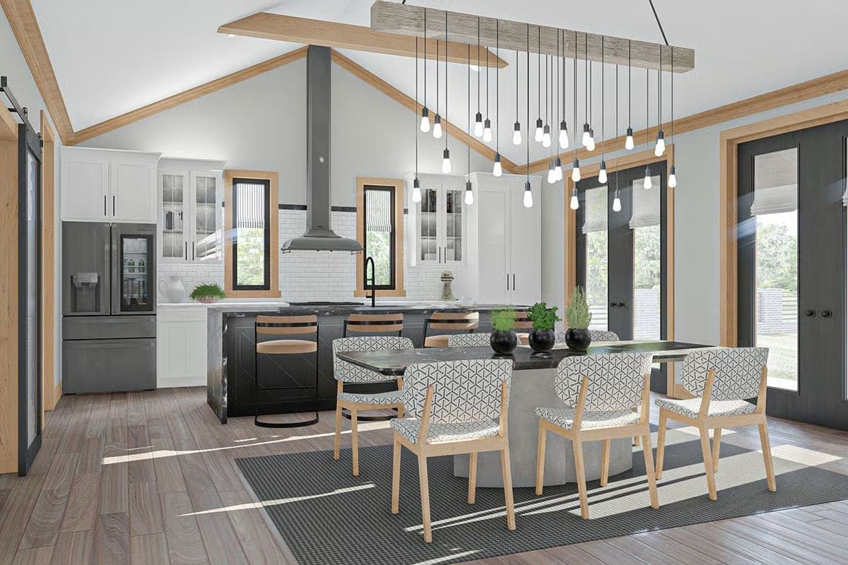Vaulted Ceilings and a Concrete Dining Table Anchor This Open Kitchen-Dining Space