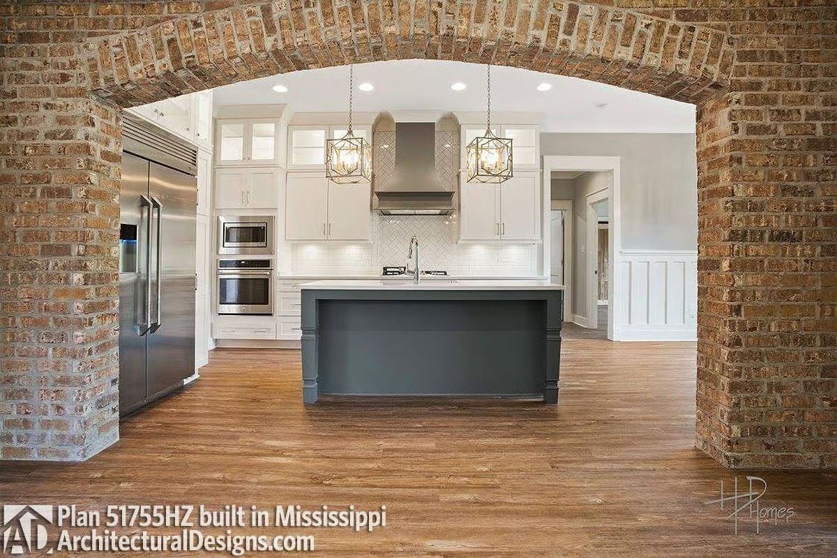 Brick Arch, Gray Island, and a Kitchen That Earns Its Open Floor Plan