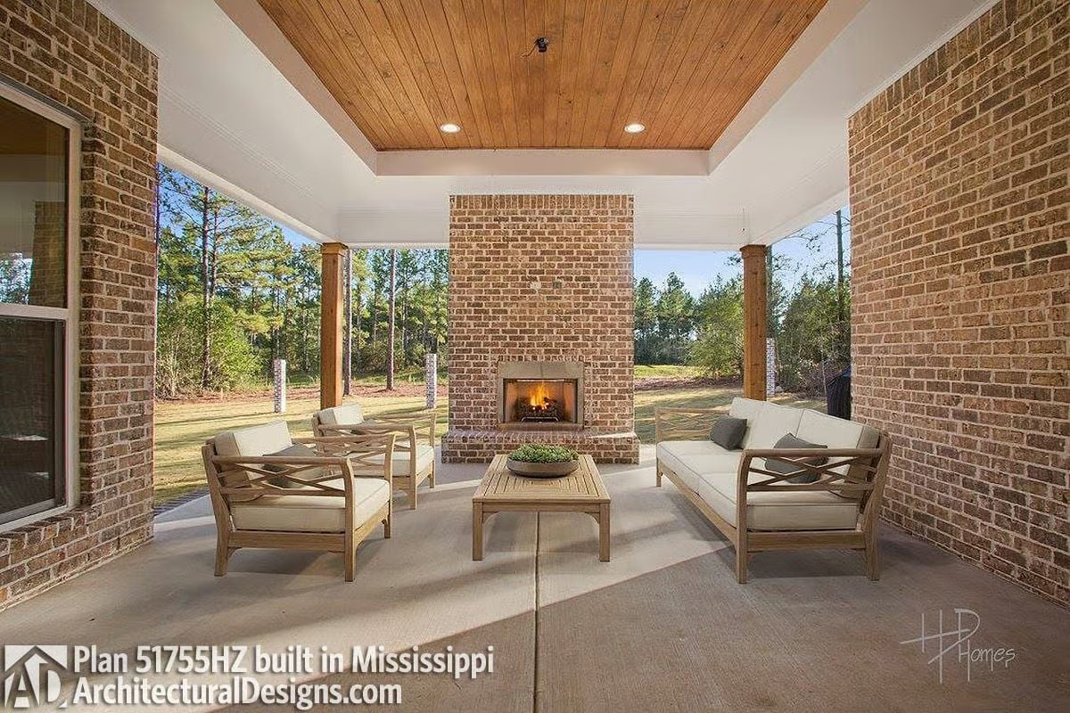 Brick Fireplace, Wood Ceiling, and Outdoor Living That Pulls You Outside Year-Round
