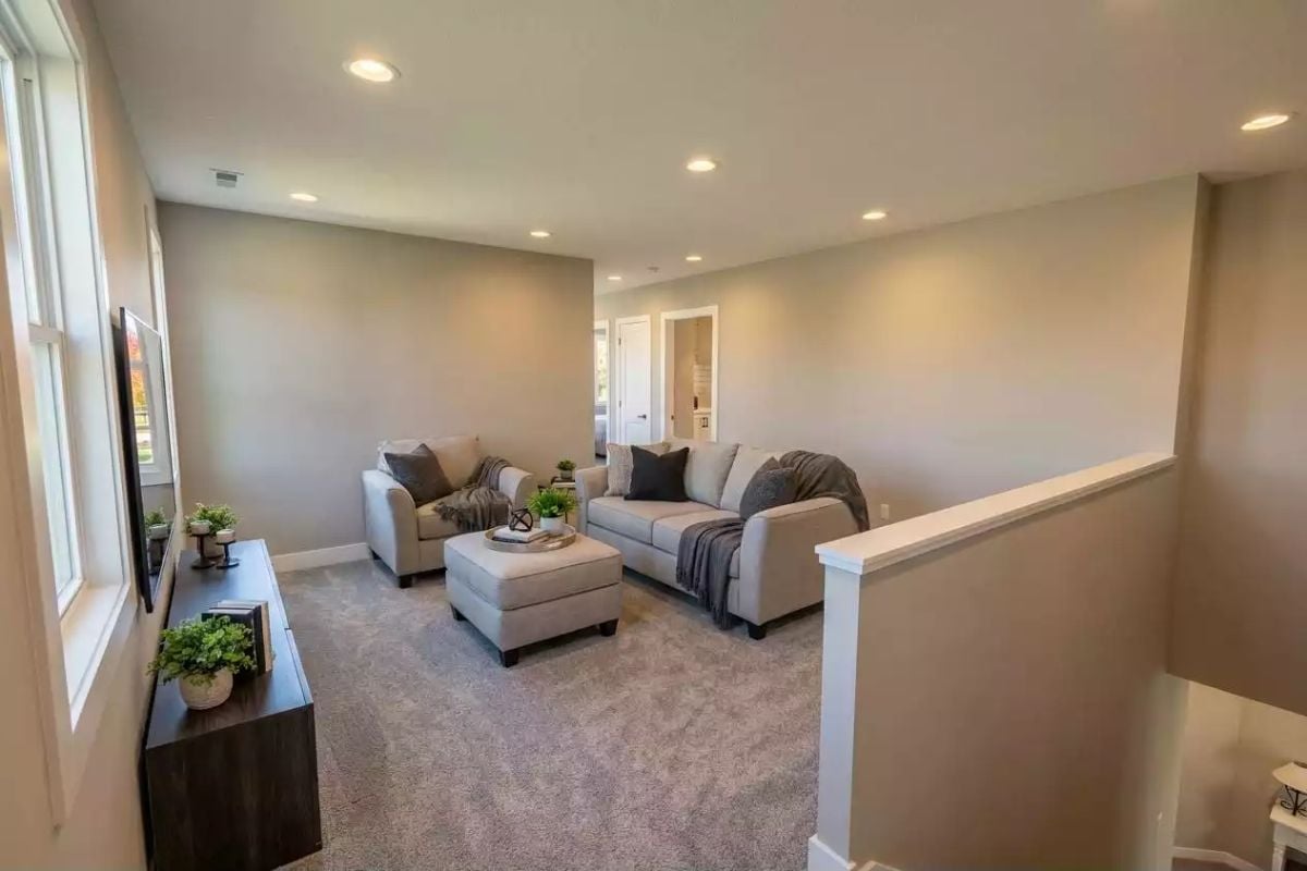 Loft Sitting Area Off the Staircase Gives Teenagers Somewhere to Actually Go