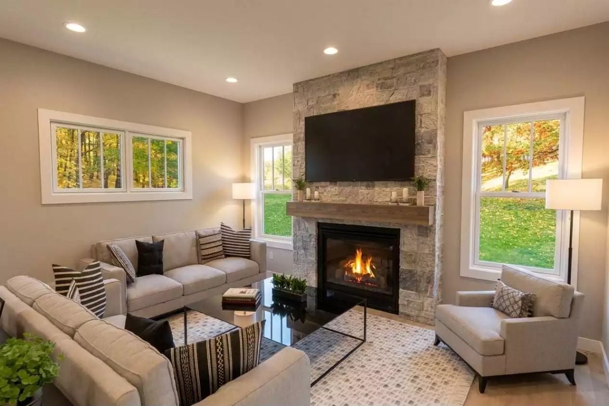 Stone Surround Floor-to-Ceiling Fireplace Earns Every Square Inch of Wall Space