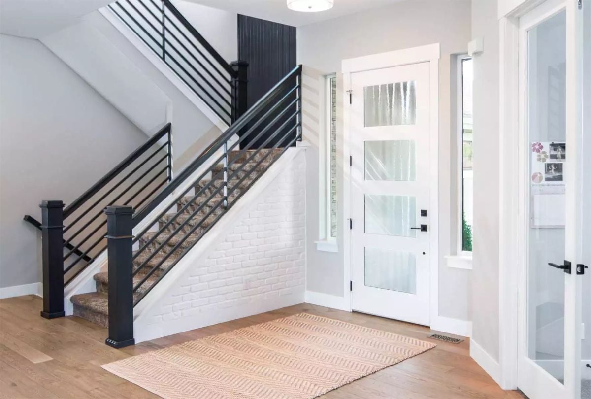 Black Steel Railings and a White Brick Stair Wall That Actually Works