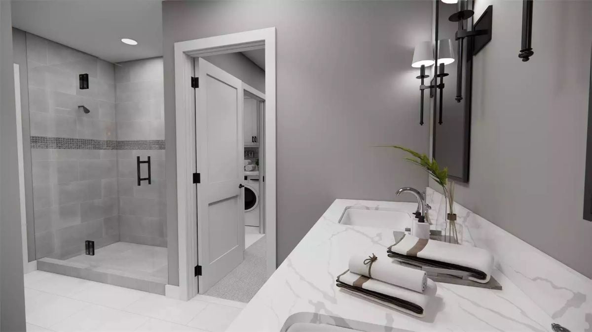 Marble Countertop, Mosaic Tile Accent Strip, and a Door That Opens Straight Into the Laundry Room