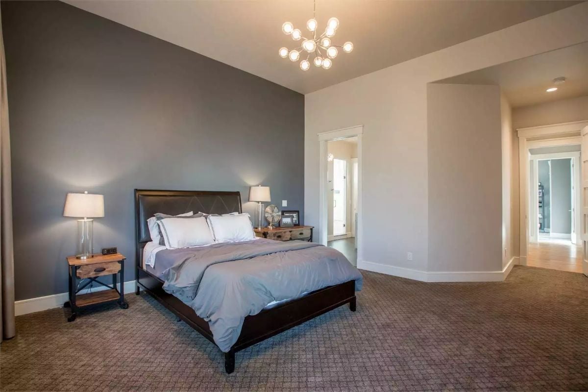 Dark Headboard Against a Charcoal Accent Wall Is a Mood, Not an Accident