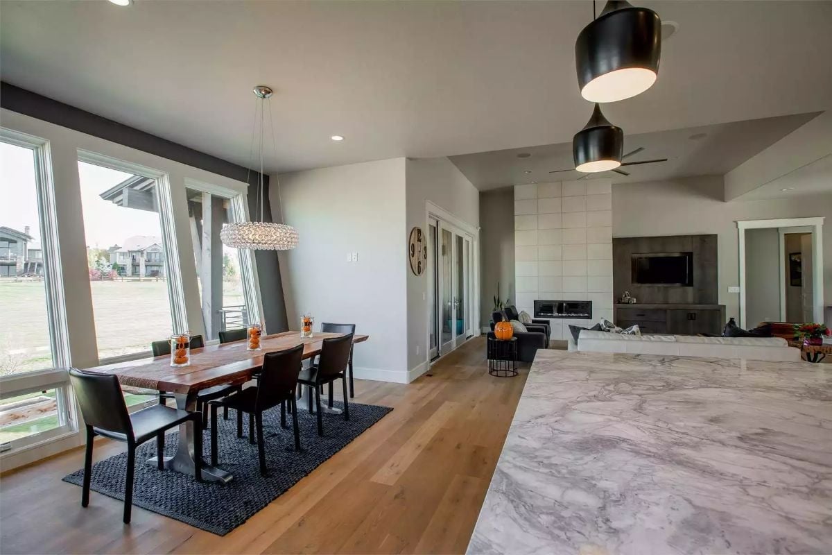 Marble Island Edge and Wood Table Share the Frame Without Fighting