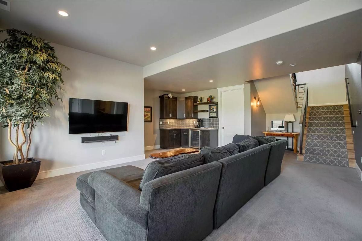 Wet Bar Tucked Into the Corner Makes This Basement Pull Its Weight