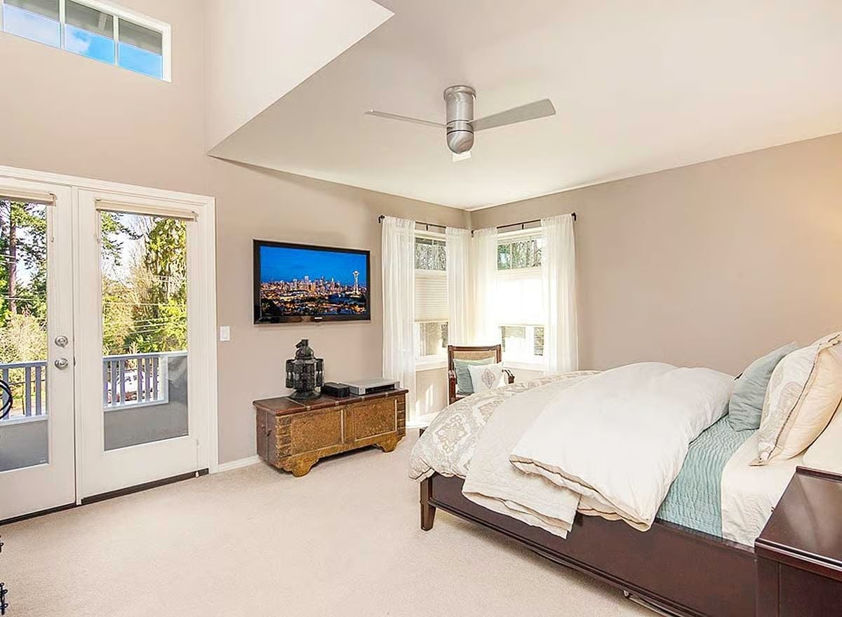 Vaulted Ceiling and French Doors Make This Master Bedroom Feel Twice Its Size
