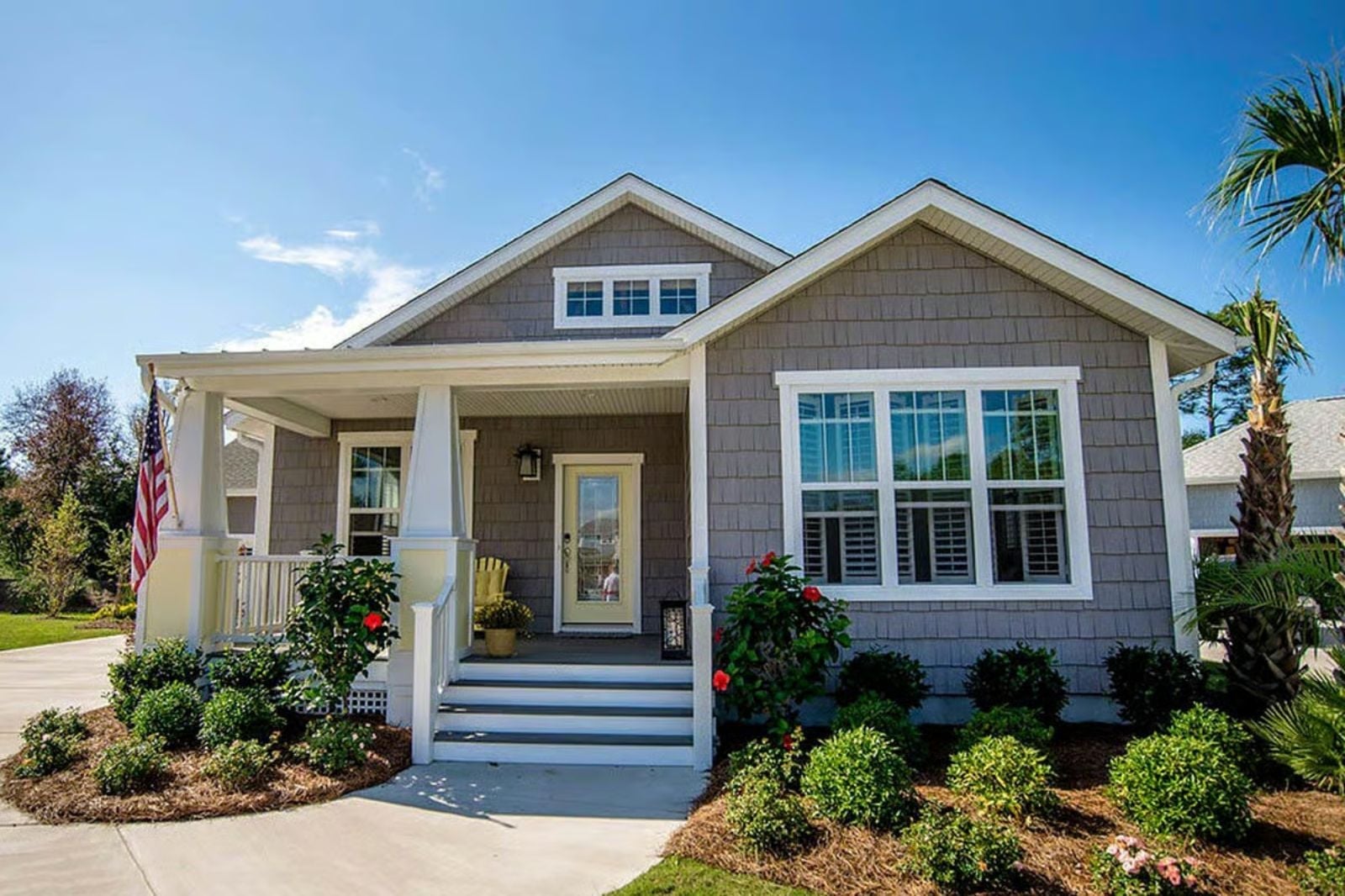 Gray Shingle Siding and a Covered Porch Built for Lingering