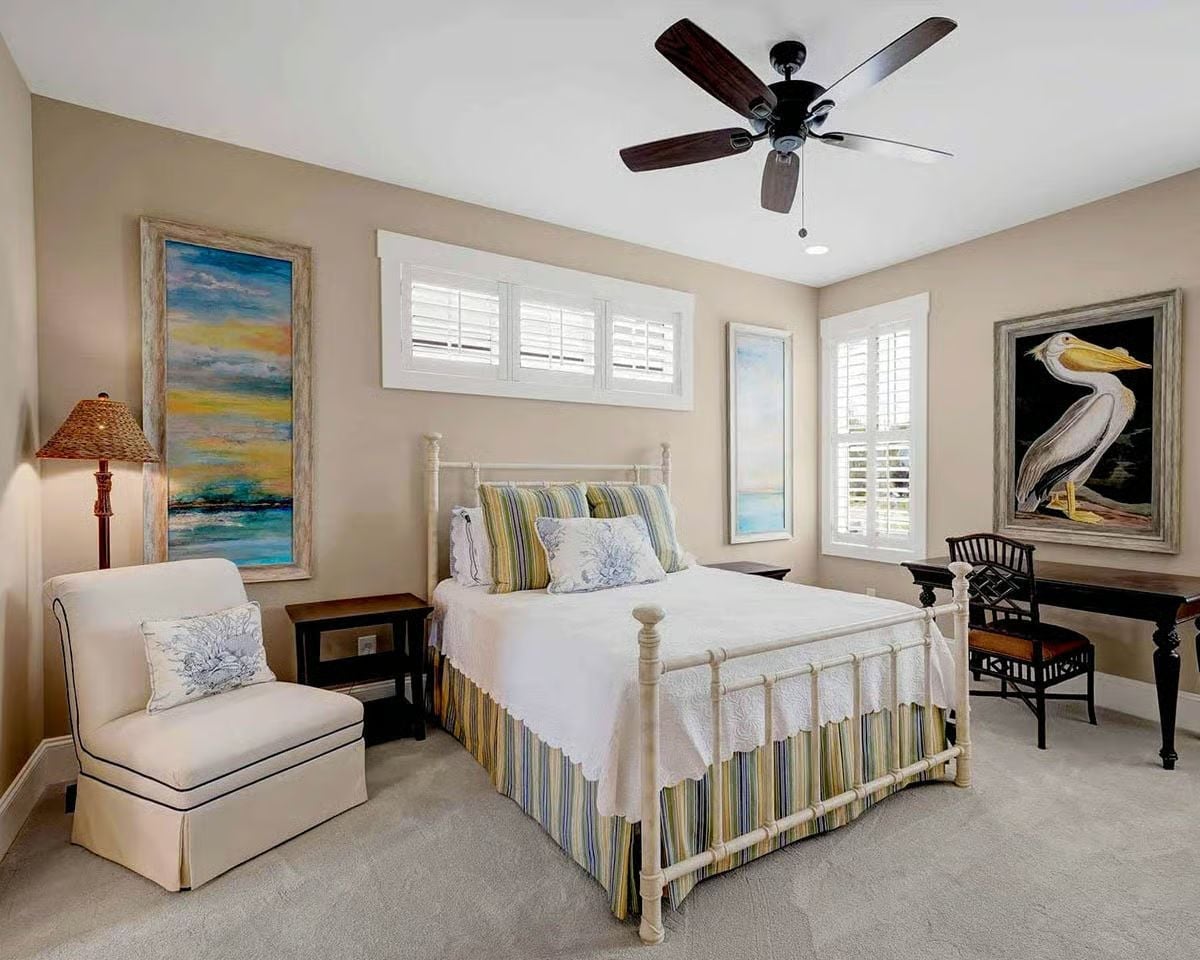 Pelican Art and Striped Linen Keep a Cottage Bedroom Grounded in Place