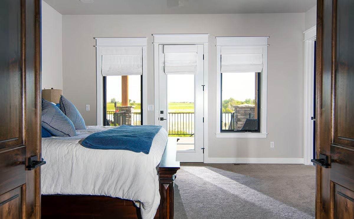 Roman Shades, Black Frames, and a Balcony Door That Earns Its Place
