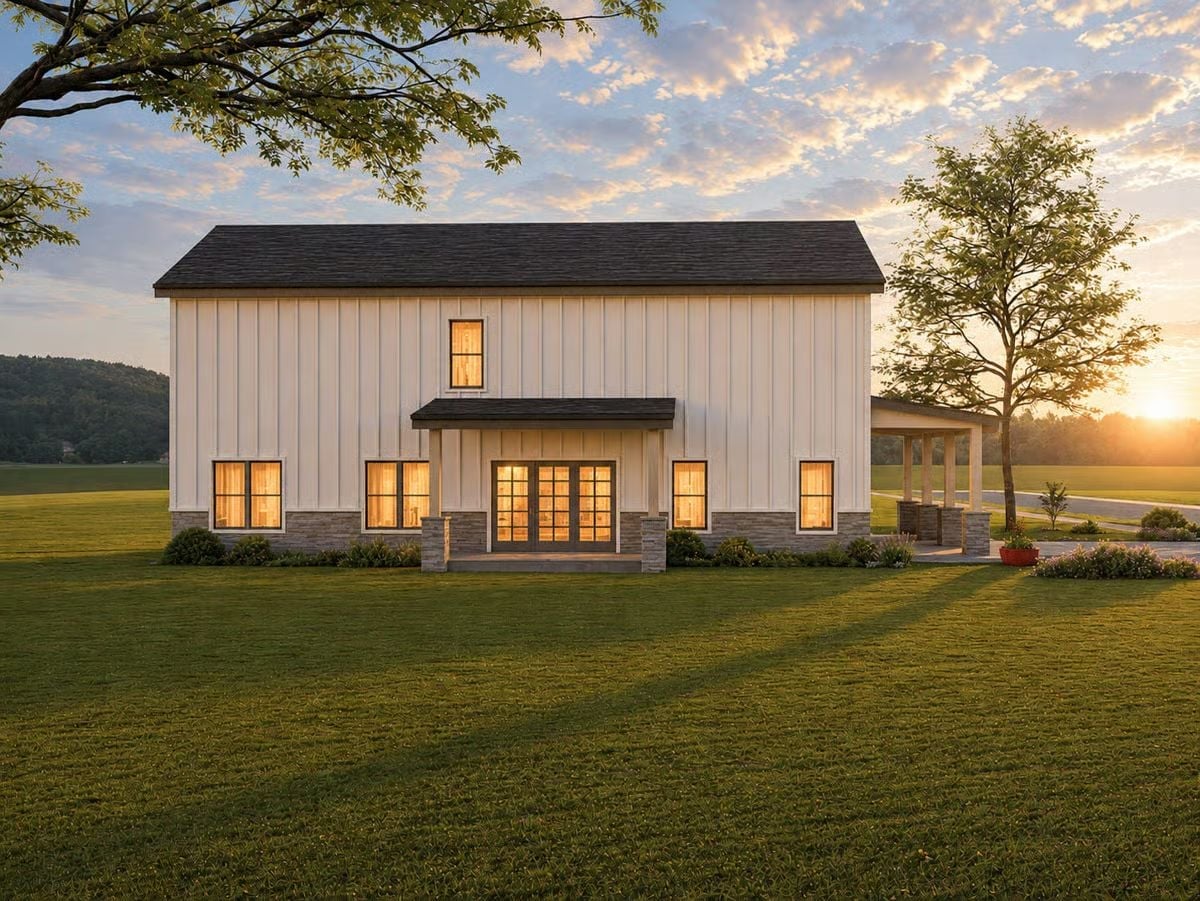 Warm Light Spills Through French Doors on This Modern Farmhouse's Back Elevation