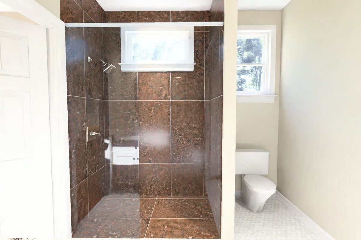 Dark Marble Tile and a Walk-In Shower With No Door to Fight With