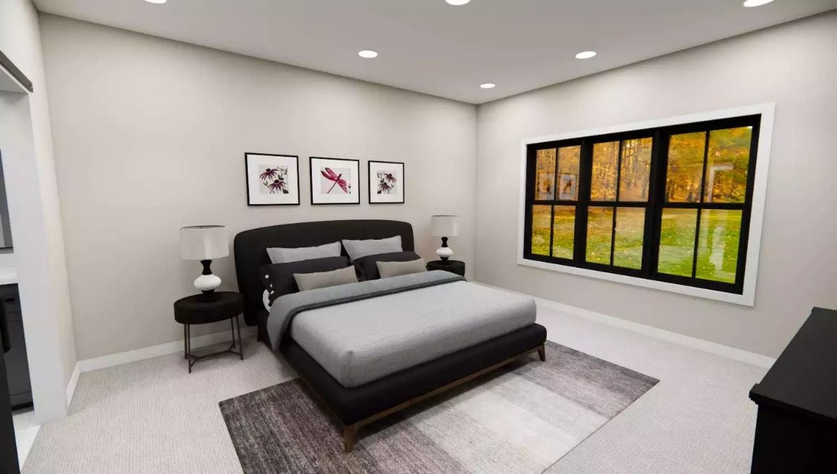 Black Upholstered Bed Against Gray Walls That Don't Need to Try Hard