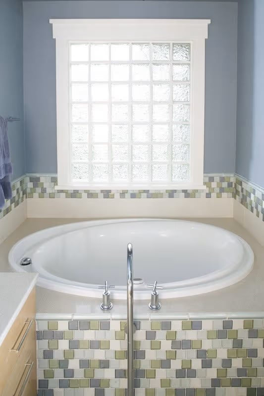 Glass Block Window and Mosaic Tile Surround Make Soaking Worth the Splurge