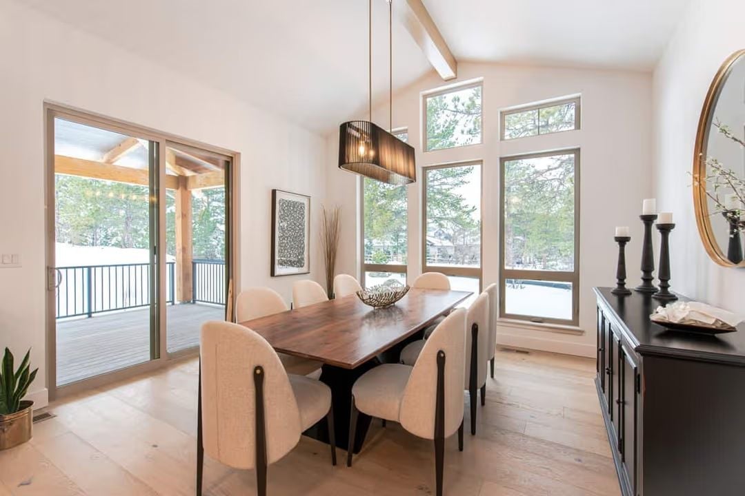 Cream Chairs, Dark Wood Table, and Views That Do Half the Work
