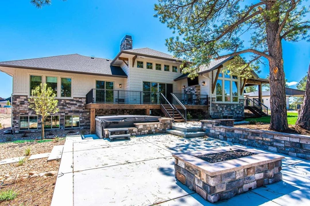 Stone Fire Pit, Hot Tub, and a Deck That Means Business