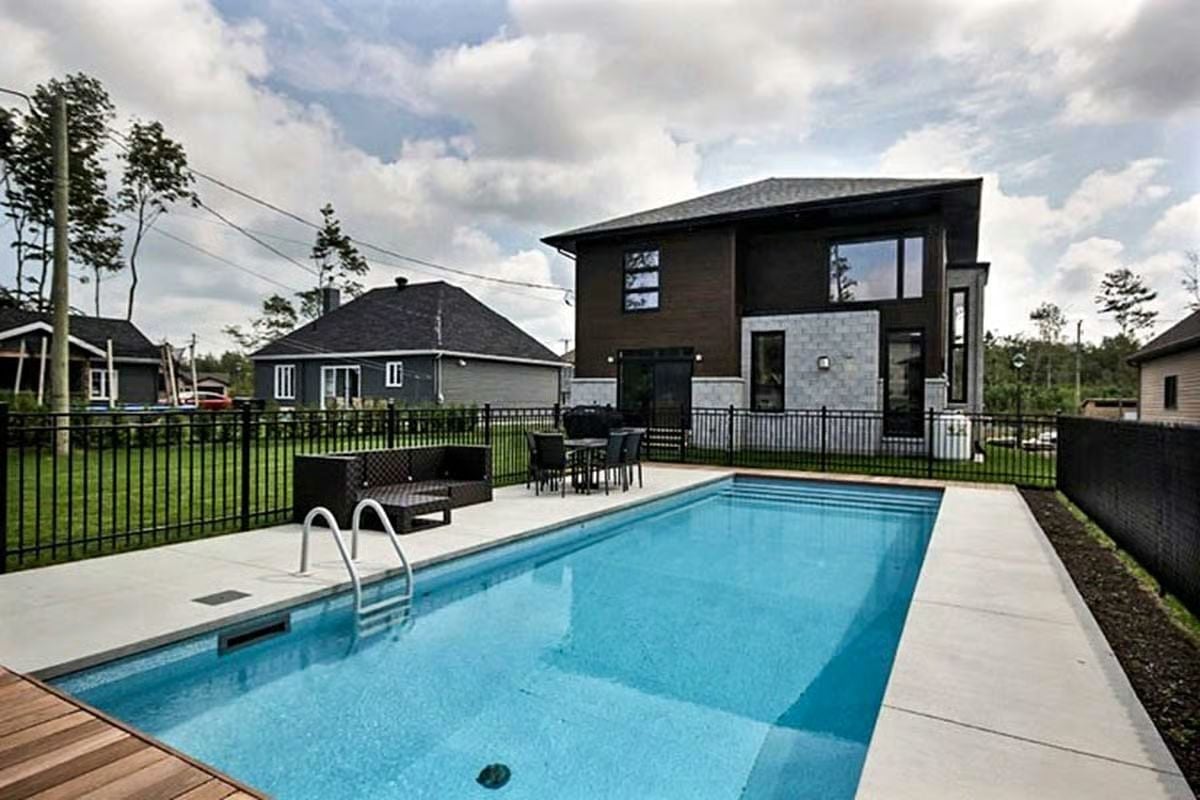Black Iron Fencing and a Clean Rectangle Pool That Means Business