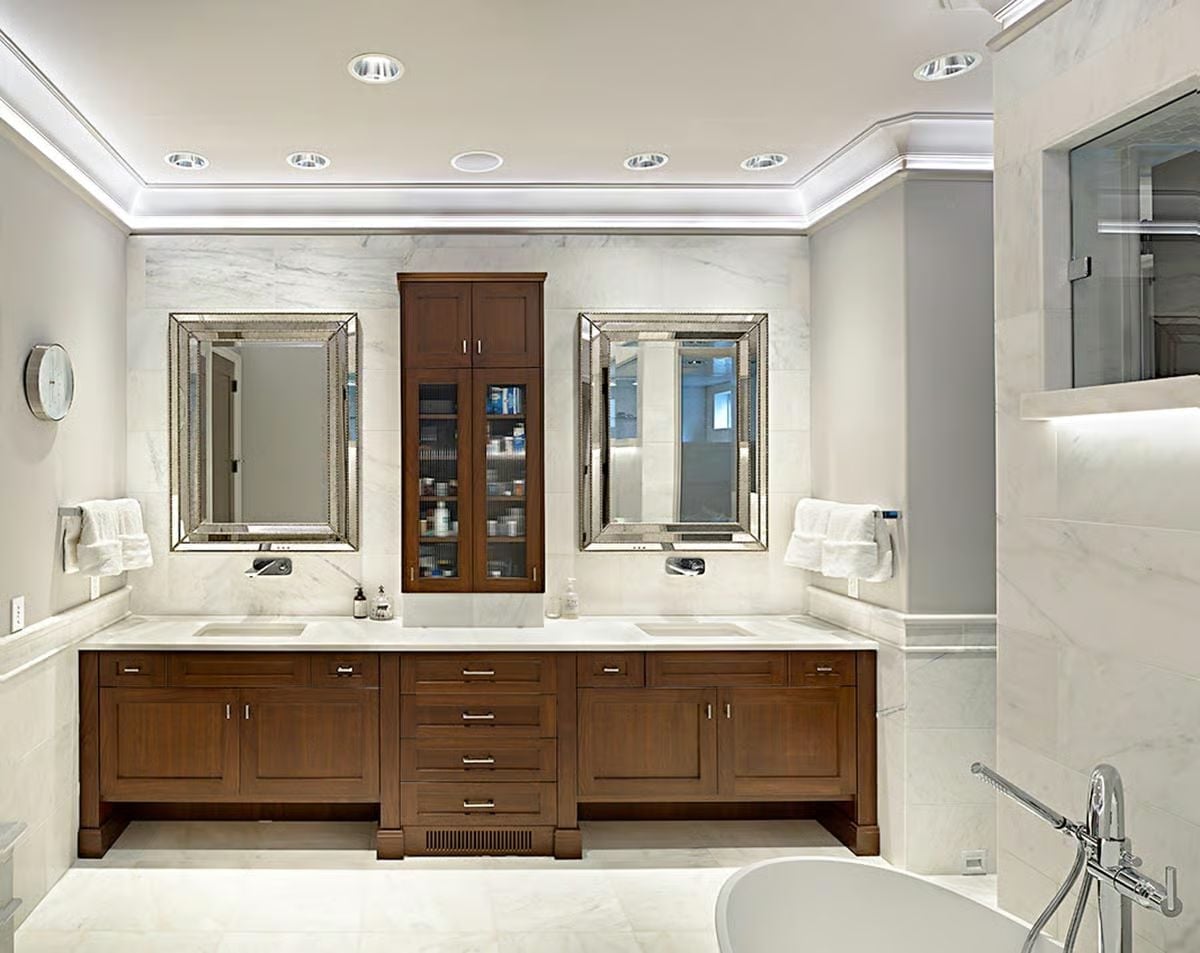 Marble Wainscoting and Warm Wood Cabinetry Pull Off a Pairing That Shouldn't Work