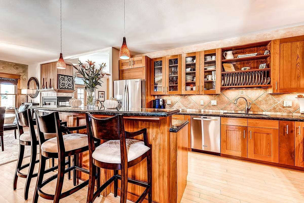 Warm Wood Cabinets and a Plate Rack That Actually Gets Used