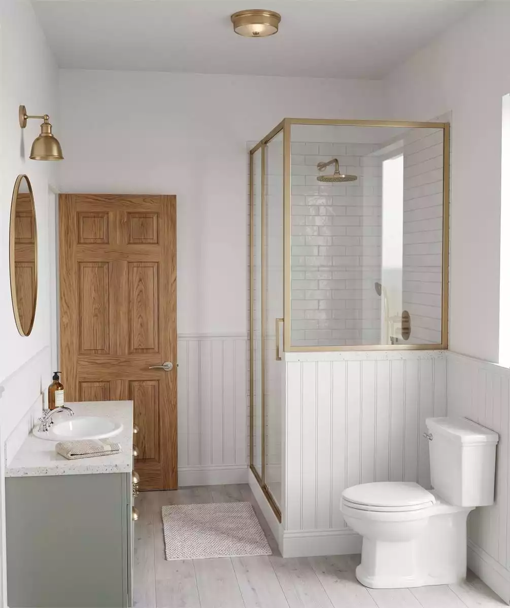 Brass Fixtures, Beadboard Wainscoting, and a Shower Enclosure That Earns Its Keep