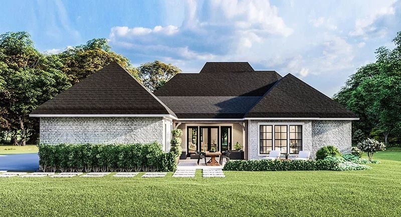Covered Patio With Outdoor Seating and Brick That Earns Every Inch of the Backyard