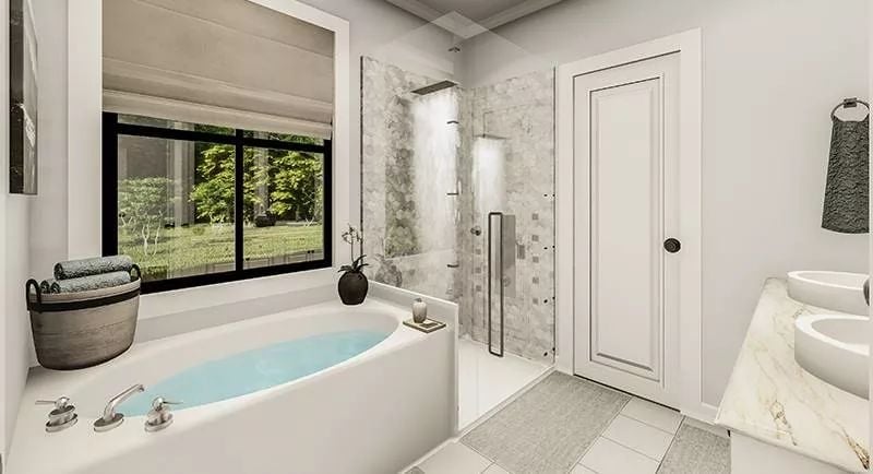 Soaking Tub With a Garden View and a Shower That Pulls Double Duty
