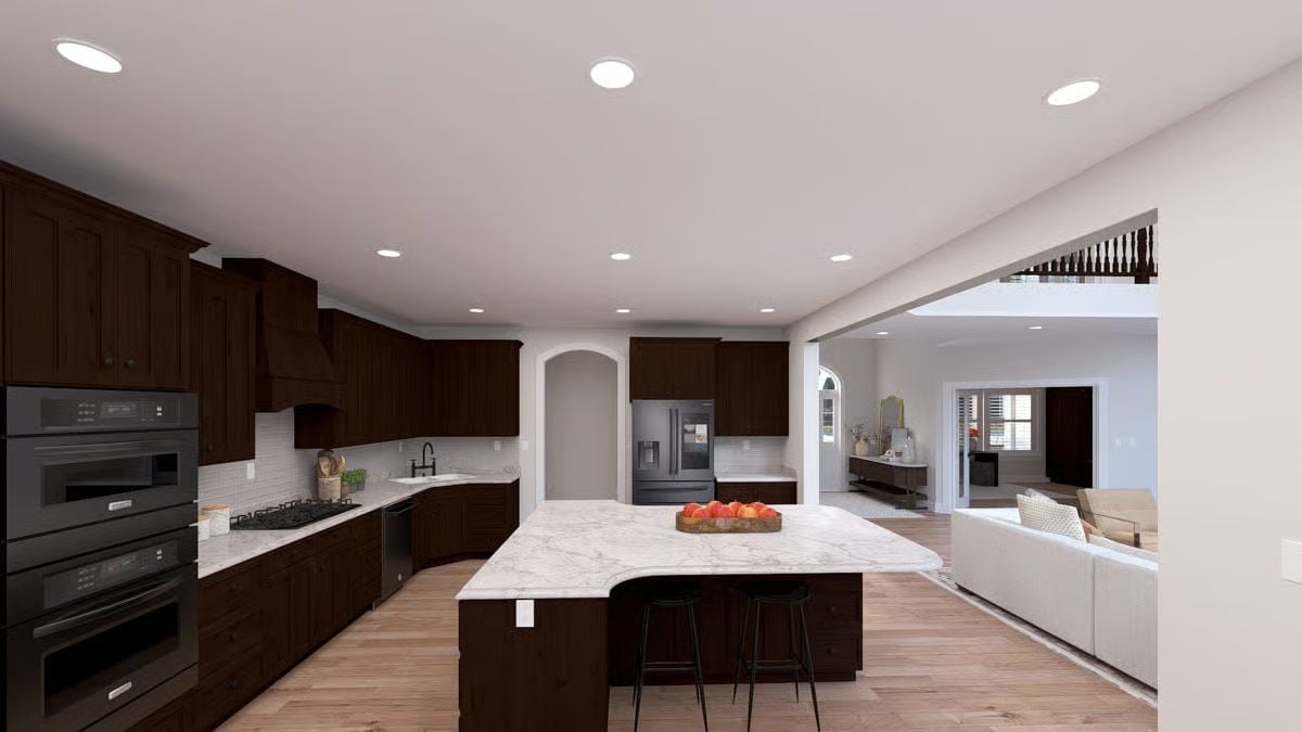 Dark Walnut Cabinetry and Marble Island Do the Heavy Lifting Here