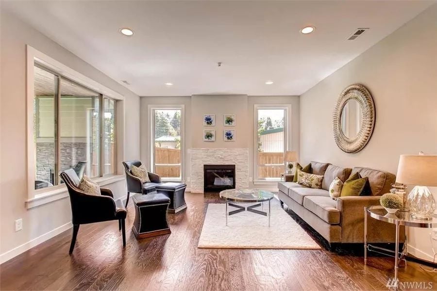 Hardwood Floors and a Stone Fireplace That Anchor the Whole Room