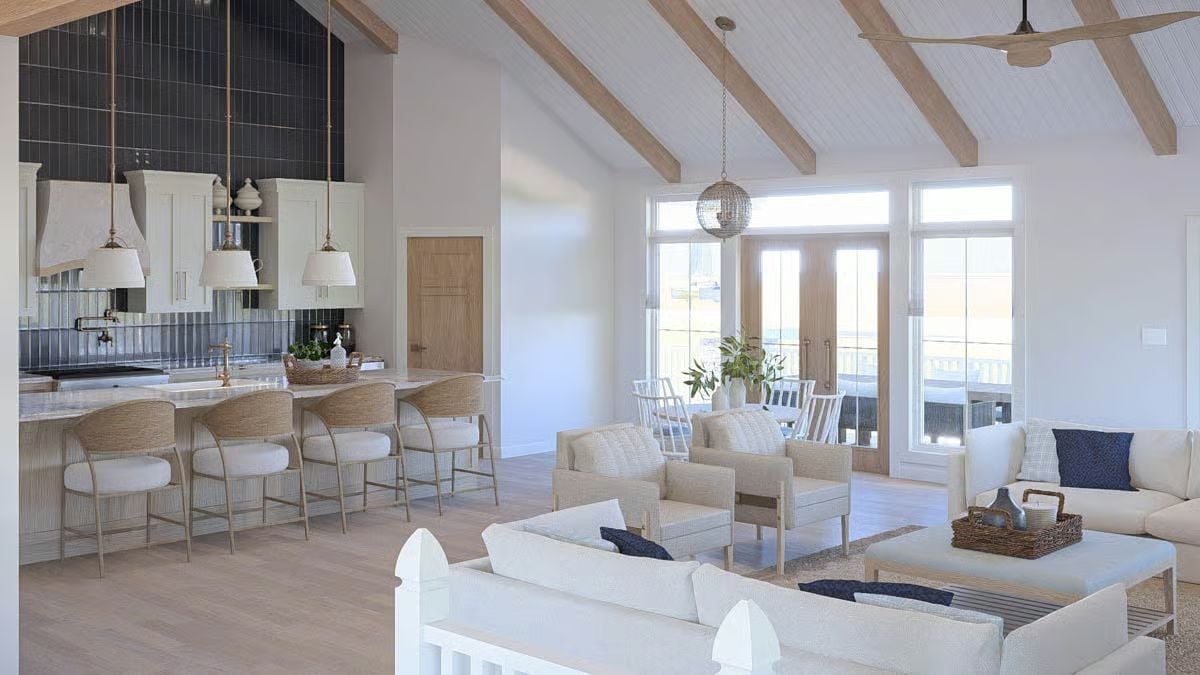 Exposed Beam Vaulting and a Dark Tile Backsplash Pull an Open-Plan Interior into Focus