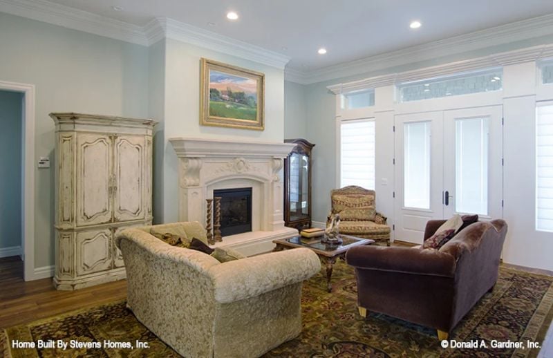 Carved Mantel, Crushed Velvet, and a Fireplace That Actually Gets Used