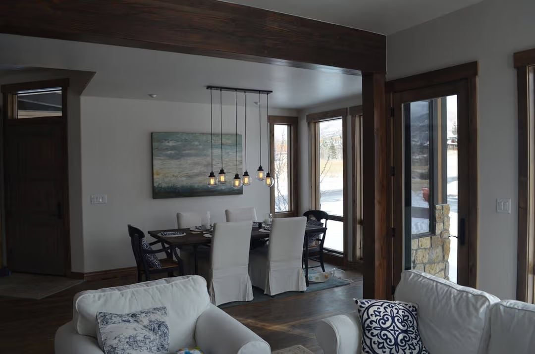 Dark Beam Archway Into a Dining Room That Actually Gets Used