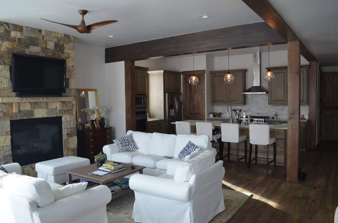 Stone Fireplace, White Slipcovers, and Zero Apologies for Mixing Both