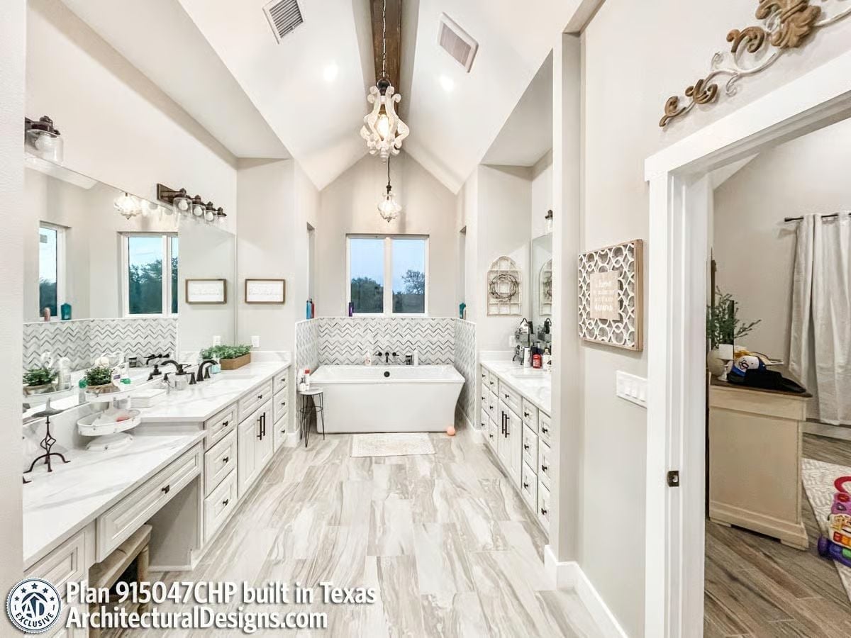 Soaking Tub Centered on Chevron Tile in a Bathroom Built for Two