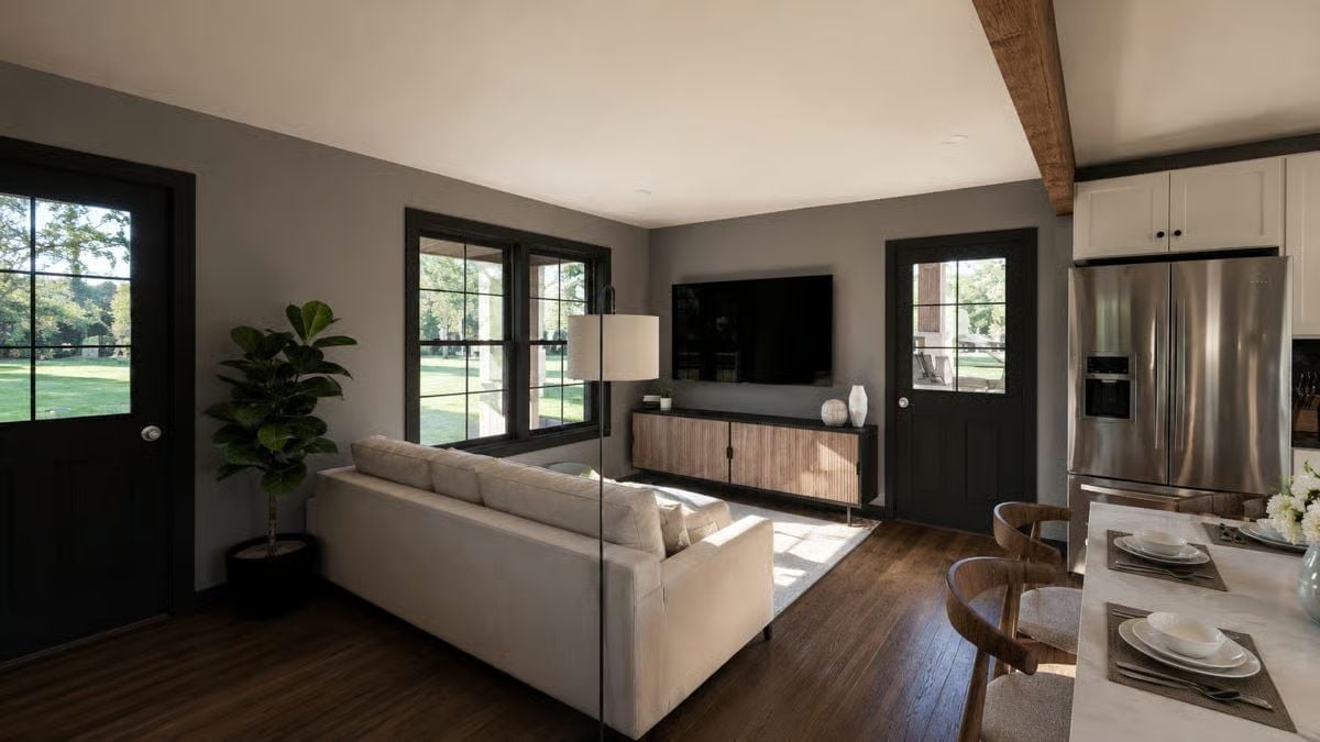 Cream Sectional, Warm Wood TV Console, and Windows That Earn Their Keep