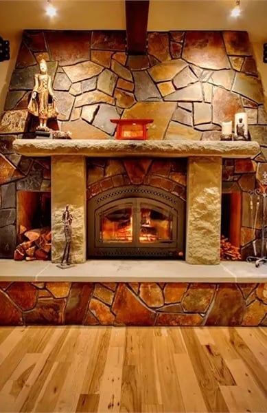 Fieldstone Surround and Iron Doors Worth Gathering Around