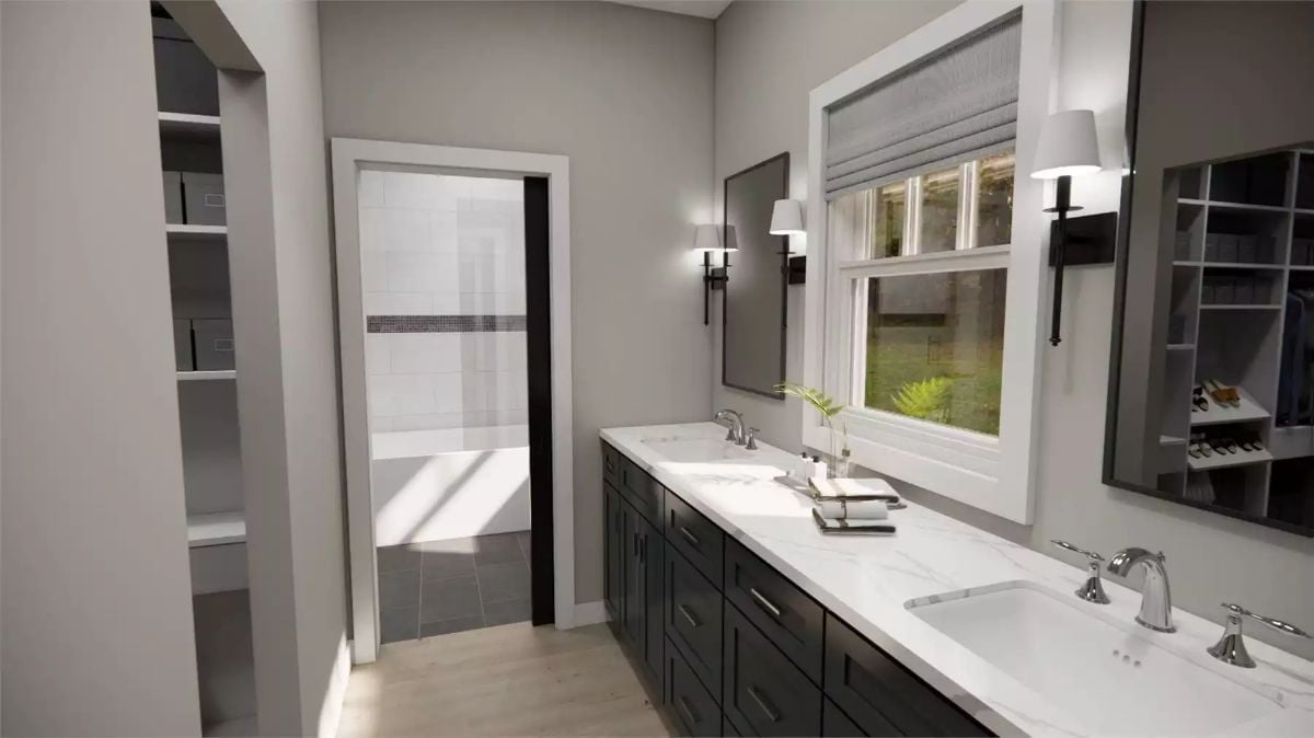Double Vanity With Marble Counters Earns Its Place Between Two Walk-In Closets